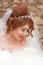 Bride with fashion wedding hairstyle and stylish hair accessory. Beautiful lace wedding dress. Royalty Free Stock Photo