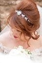 Bride with fashion wedding hairstyle and stylish hair accessory. Beautiful lace wedding dress. Royalty Free Stock Photo