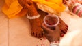 Bride feet coloring ceremony, a Hindu wedding ritual,