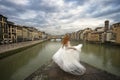 Bride in Florence. Ponte vecchio old bridge. Florence, Italy