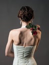 Bride with a flower. Beautiful woman with red roses Royalty Free Stock Photo