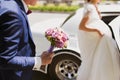 Bride gets into the car