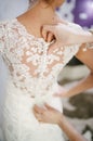 Bride getting dressed on her wedding day Royalty Free Stock Photo