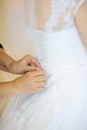 Bride getting dressed on her wedding day Royalty Free Stock Photo