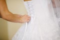 Bride getting dressed on her wedding day Royalty Free Stock Photo