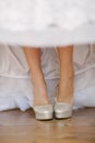 Bride getting dressed shoes on her wedding day Royalty Free Stock Photo