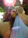 Bride getting her veil adjusted at her outdoor wedding