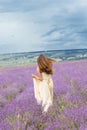 Bride girl is running at lavender field Royalty Free Stock Photo