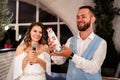 The bride gives a speech into the microphone and gives a surprise gift