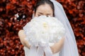 Bride giving flower or bouquet in her hands with a copy space