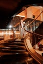 Bride on a golden spiral staircase.