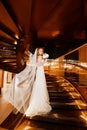 Bride on a golden spiral staircase.