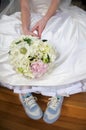 Bride in gown and tennis shoes