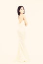 Bride, graceful girl in dress. Fashion model demonstrate expensive fashionable evening dress or wedding dress. Fashion Royalty Free Stock Photo