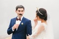 Bride and groom attached to face paper mustache , crown Royalty Free Stock Photo