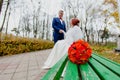 Bride and groom in the autumn park