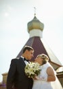 Bride and groom on background of Christian Church