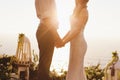 The bride and groom on the background of the Ocean during sunset Royalty Free Stock Photo