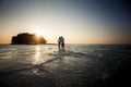 Bride and groom barefoot at spit Royalty Free Stock Photo