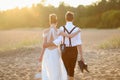 Bride and groom on a beach at sunset Royalty Free Stock Photo