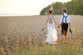 Bride and groom on a beach at sunset Royalty Free Stock Photo