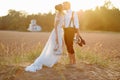 Bride and groom on a beach at sunset Royalty Free Stock Photo