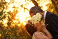 Bride and groom in a beautiful light holding hug