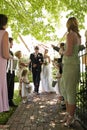 Bride And Groom Being Showered With Flower Petals