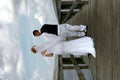 Bride and Groom on boardwalk Royalty Free Stock Photo