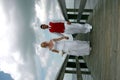 Bride and Groom on boardwalk Royalty Free Stock Photo