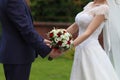 Bride and groom with bouquet Royalty Free Stock Photo