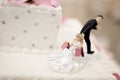 Bride and Groom cake toppers on a wedding cake Royalty Free Stock Photo