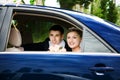 Bride and groom in the car Royalty Free Stock Photo