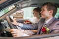 Bride and groom in a car in a wedding Royalty Free Stock Photo