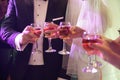 bride and groom close champagne filled wedding glasses Royalty Free Stock Photo