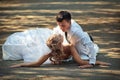 Bride and groom on countryside road Royalty Free Stock Photo