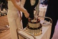 Bride and groom cut the wedding cake