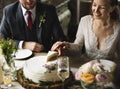 Bride and Groom Cutting Cake on Wedding Reception Royalty Free Stock Photo