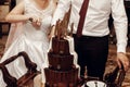 Bride and groom cutting and tasting wedding cake. big delicious Royalty Free Stock Photo