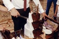 Bride and groom cutting and tasting wedding cake. big delicious Royalty Free Stock Photo