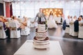 A bride and a groom is cutting their beautiful wedding cake. nicel light. wedding concept Royalty Free Stock Photo