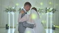 The bride and groom dance at their wedding day banquet.