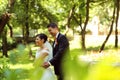 Bride and groom dancing in the park Royalty Free Stock Photo