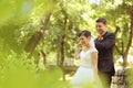 Bride and groom dancing in the park Royalty Free Stock Photo