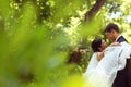 Bride and groom dancing in the park Royalty Free Stock Photo