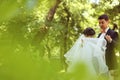 Bride and groom dancing in the park Royalty Free Stock Photo