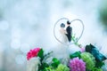 Bride and groom doll on bouquet in wedding ceremony