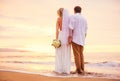 Bride and Groom, Enjoying Amazing Sunset on a Beautiful Tropical Royalty Free Stock Photo