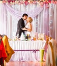 Bride And Groom Enjoying Meal At Wedding Reception Royalty Free Stock Photo