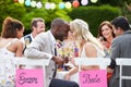 Bride And Groom Enjoying Meal At Wedding Reception Royalty Free Stock Photo